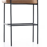 Featuring Carrie Chaps Saddle Bar + Counter Stool by Four Hands at Amethyst Home. Airy and light with slim, matte black-finished iron framing, tan top-grain leather lends sleekness to a beautifully sculpted counter style featuring a yoke back and exterior fold detailing.BarOverall Dimensions: 25.50"w x 23.00"d x 39.50"hWeight: 33.95 lbsCounterOverall Dimensi. Amethyst Home provides interior design, new home construction design consulting, vintage area rugs, and lighting in the Portland metro area.