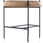 Featuring Carrie Chaps Saddle Bar + Counter Stool by Four Hands at Amethyst Home. Airy and light with slim, matte black-finished iron framing, tan top-grain leather lends sleekness to a beautifully sculpted counter style featuring a yoke back and exterior fold detailing.BarOverall Dimensions: 25.50"w x 23.00"d x 39.50"hWeight: 33.95 lbsCounterOverall Dimens. Amethyst Home provides interior design, new home construction design consulting, vintage area rugs, and lighting in the San Diego metro area.