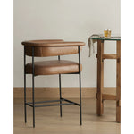 Featuring Carrie Chaps Saddle Bar + Counter Stool by Four Hands at Amethyst Home. Airy and light with slim, matte black-finished iron framing, tan top-grain leather lends sleekness to a beautifully sculpted counter style featuring a yoke back and exterior fold detailing.BarOverall Dimensions: 25.50"w x 23.00"d x 39.50"hWeight: 33.95 lbsCounterOverall Dimensions. Amethyst Home provides interior design, new home construction design consulting, vintage area rugs, and lighting in the Tampa metro area.