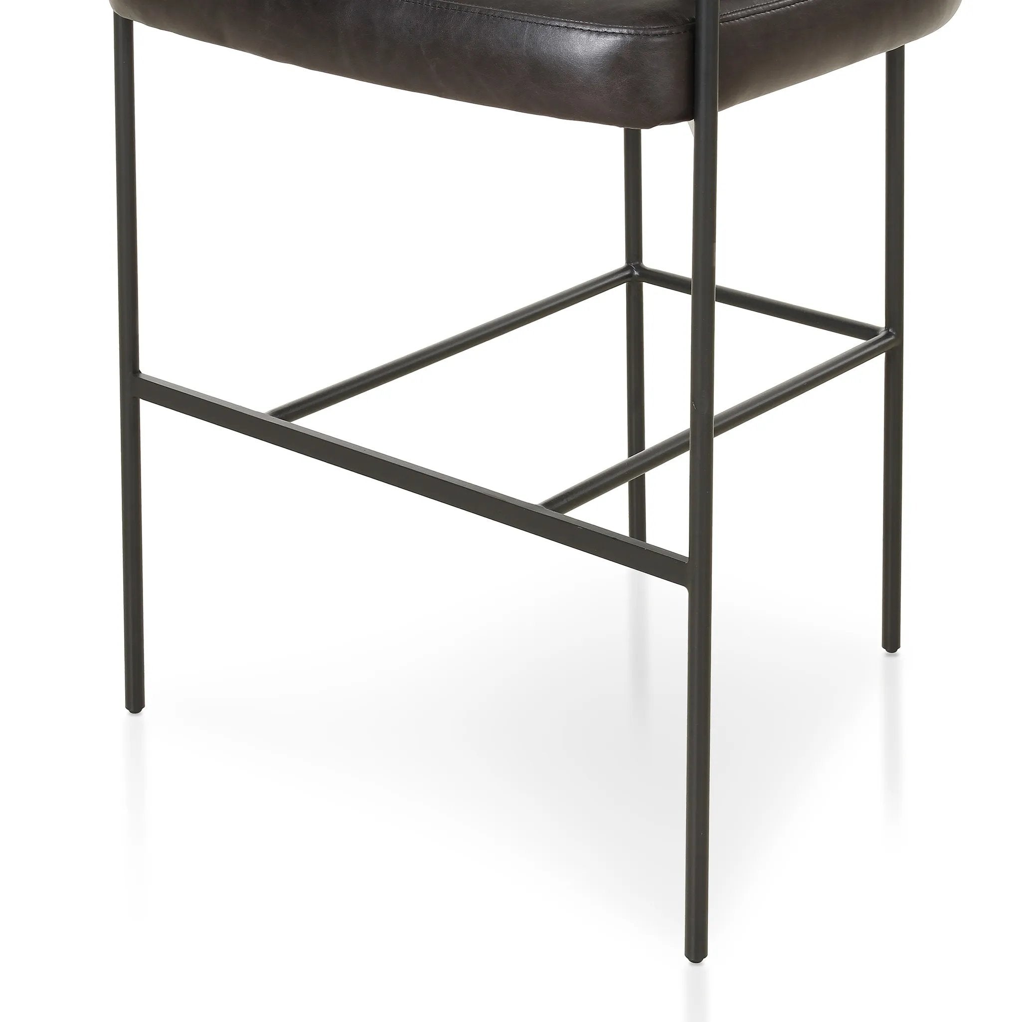 Featuring Carrie Sonoma Black Bar + Counter Stool by Four Hands at Amethyst Home. Airy and light with slim, black-finished iron framing, top-grain leather lends texture to a beautifully sculpted bar stool featuring a yoke back plus fold detailing.BarOverall Dimensions: 25.50"w x 23.00"d x 39.50"hWeight: 33.95 lbsCounterOverall Dimensions: 25.50"w x 23.00"d x 3. Amethyst Home provides interior design, new home construction design consulting, vintage area rugs, and lighting in the Boston metro area.