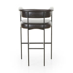 Featuring Carrie Sonoma Black Bar + Counter Stool by Four Hands at Amethyst Home. Airy and light with slim, black-finished iron framing, top-grain leather lends texture to a beautifully sculpted bar stool featuring a yoke back plus fold detailing.BarOverall Dimensions: 25.50"w x 23.00"d x 39.50"hWeight: 33.95 lbsCounterOverall Dimensions: 25.50"w x 23.00"d . Amethyst Home provides interior design, new home construction design consulting, vintage area rugs, and lighting in the Calabasas metro area.