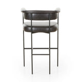 Featuring Carrie Sonoma Black Bar + Counter Stool by Four Hands at Amethyst Home. Airy and light with slim, black-finished iron framing, top-grain leather lends texture to a beautifully sculpted bar stool featuring a yoke back plus fold detailing.BarOverall Dimensions: 25.50"w x 23.00"d x 39.50"hWeight: 33.95 lbsCounterOverall Dimensions: 25.50"w x 23.00"d . Amethyst Home provides interior design, new home construction design consulting, vintage area rugs, and lighting in the Calabasas metro area.