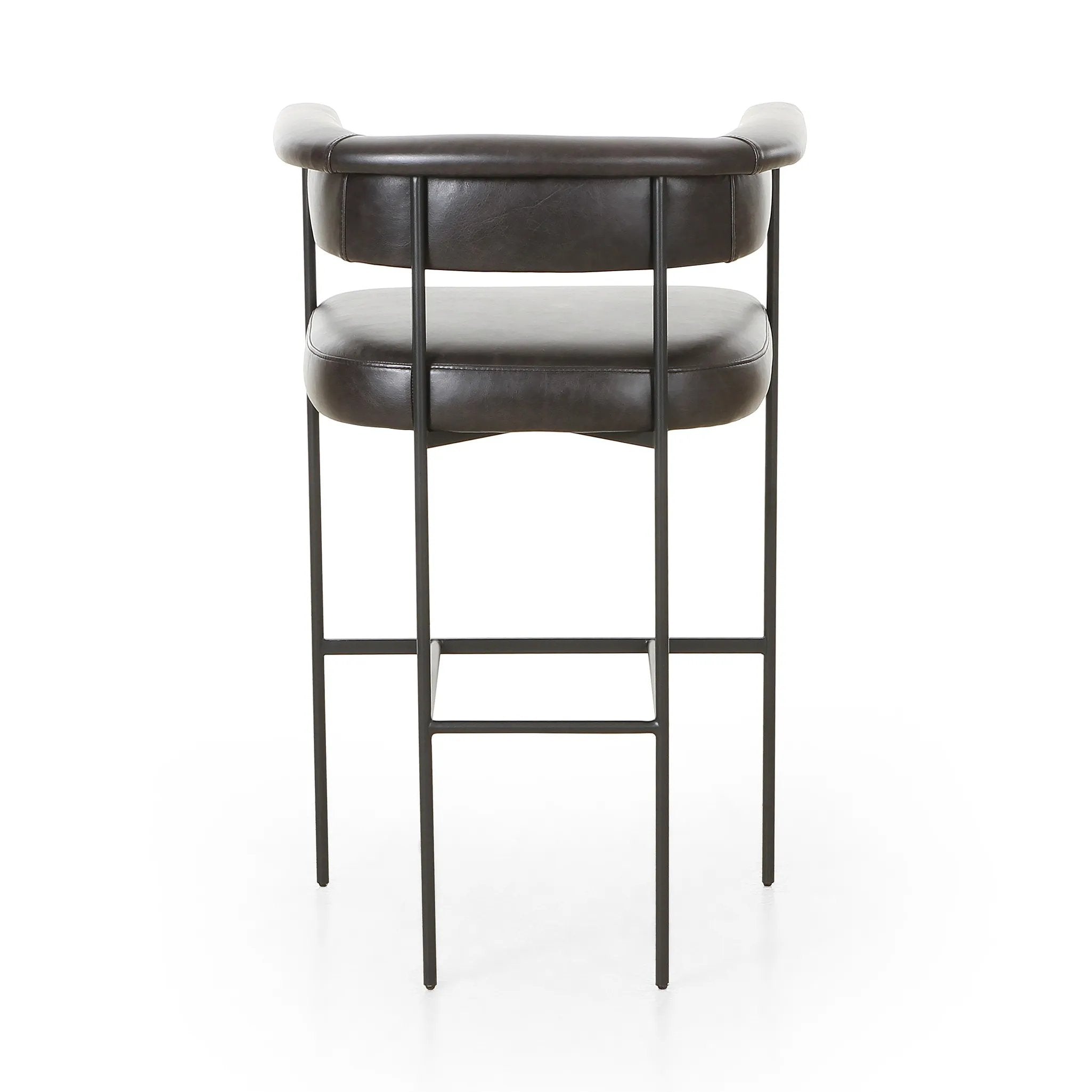 Featuring Carrie Sonoma Black Bar + Counter Stool by Four Hands at Amethyst Home. Airy and light with slim, black-finished iron framing, top-grain leather lends texture to a beautifully sculpted bar stool featuring a yoke back plus fold detailing.BarOverall Dimensions: 25.50"w x 23.00"d x 39.50"hWeight: 33.95 lbsCounterOverall Dimensions: 25.50"w x 23.00"d . Amethyst Home provides interior design, new home construction design consulting, vintage area rugs, and lighting in the Calabasas metro area.