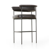 Featuring Carrie Sonoma Black Bar + Counter Stool by Four Hands at Amethyst Home. Airy and light with slim, black-finished iron framing, top-grain leather lends texture to a beautifully sculpted bar stool featuring a yoke back plus fold detailing.BarOverall Dimensions: 25.50"w x 23.00"d x 39.50"hWeight: 33.95 lbsCounterOverall Dimensions: 25.50"w x 23.00". Amethyst Home provides interior design, new home construction design consulting, vintage area rugs, and lighting in the Kansas City metro area.