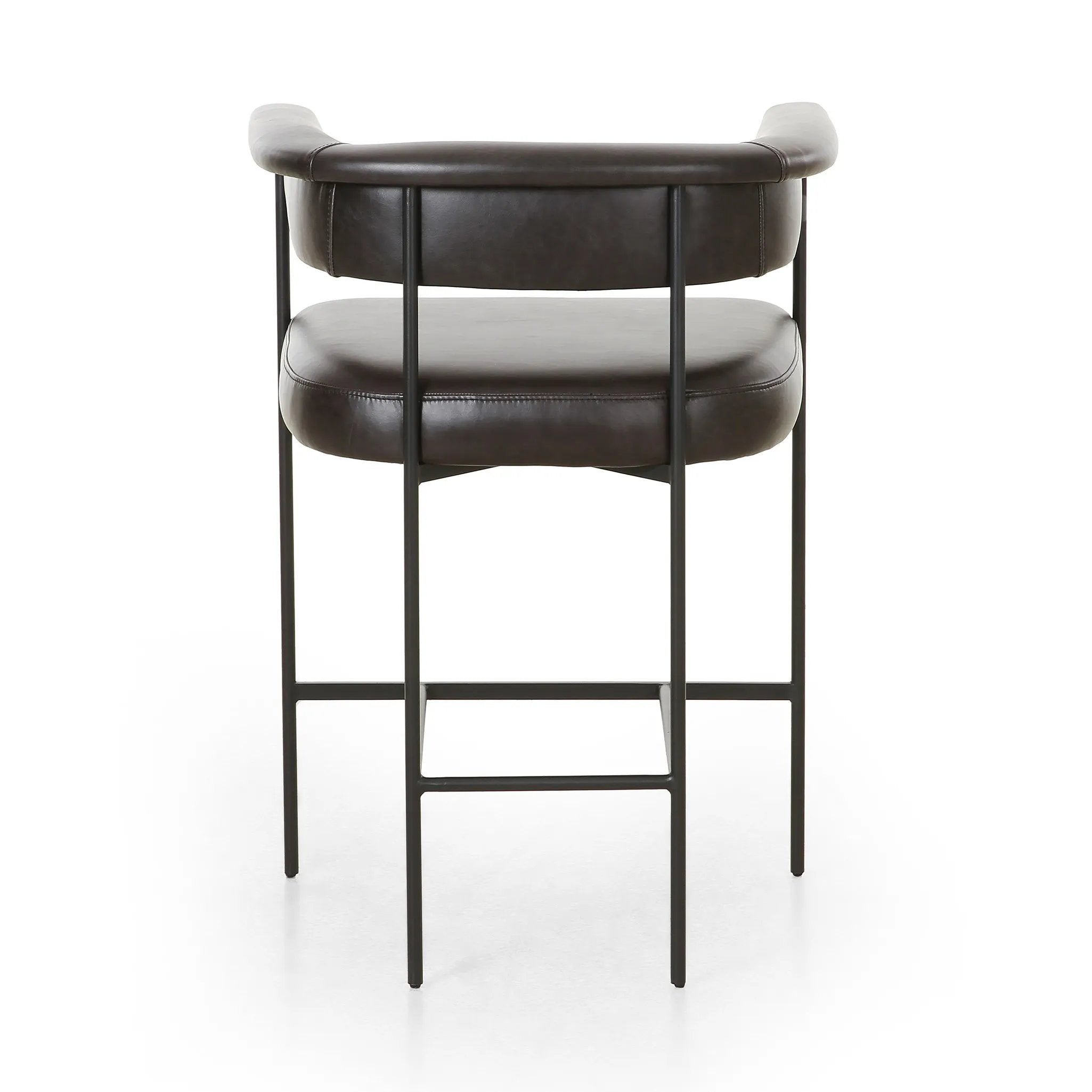 Featuring Carrie Sonoma Black Bar + Counter Stool by Four Hands at Amethyst Home. Airy and light with slim, black-finished iron framing, top-grain leather lends texture to a beautifully sculpted bar stool featuring a yoke back plus fold detailing.BarOverall Dimensions: 25.50"w x 23.00"d x 39.50"hWeight: 33.95 lbsCounterOverall Dimensions: 25.50"w x 23.00"d . Amethyst Home provides interior design, new home construction design consulting, vintage area rugs, and lighting in the Nashville metro area.
