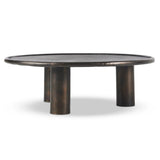 Featuring Cary Distressed Bronze Coffee Table by Four Hands at Amethyst Home. A round, three-legged coffee table of cast aluminum is finished in a beautiful distressed bronze. The result: a luxe take on industrial that moves between spaces and styles with ease.Overall Dimensions: 50.00"w x 50.00"d x 15.75"hWeight : 132.54 lbsMaterials: Aluminum. Amethyst Home provides interior design, new home construction design consulting, vintage area rugs, and lighting in the Boston metro area.