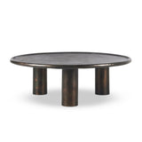 Featuring Cary Distressed Bronze Coffee Table by Four Hands at Amethyst Home. A round, three-legged coffee table of cast aluminum is finished in a beautiful distressed bronze. The result: a luxe take on industrial that moves between spaces and styles with ease.Overall Dimensions: 50.00"w x 50.00"d x 15.75"hWeight : 132.54 lbsMaterials: Aluminum. Amethyst Home provides interior design, new home construction design consulting, vintage area rugs, and lighting in the Park City metro area.