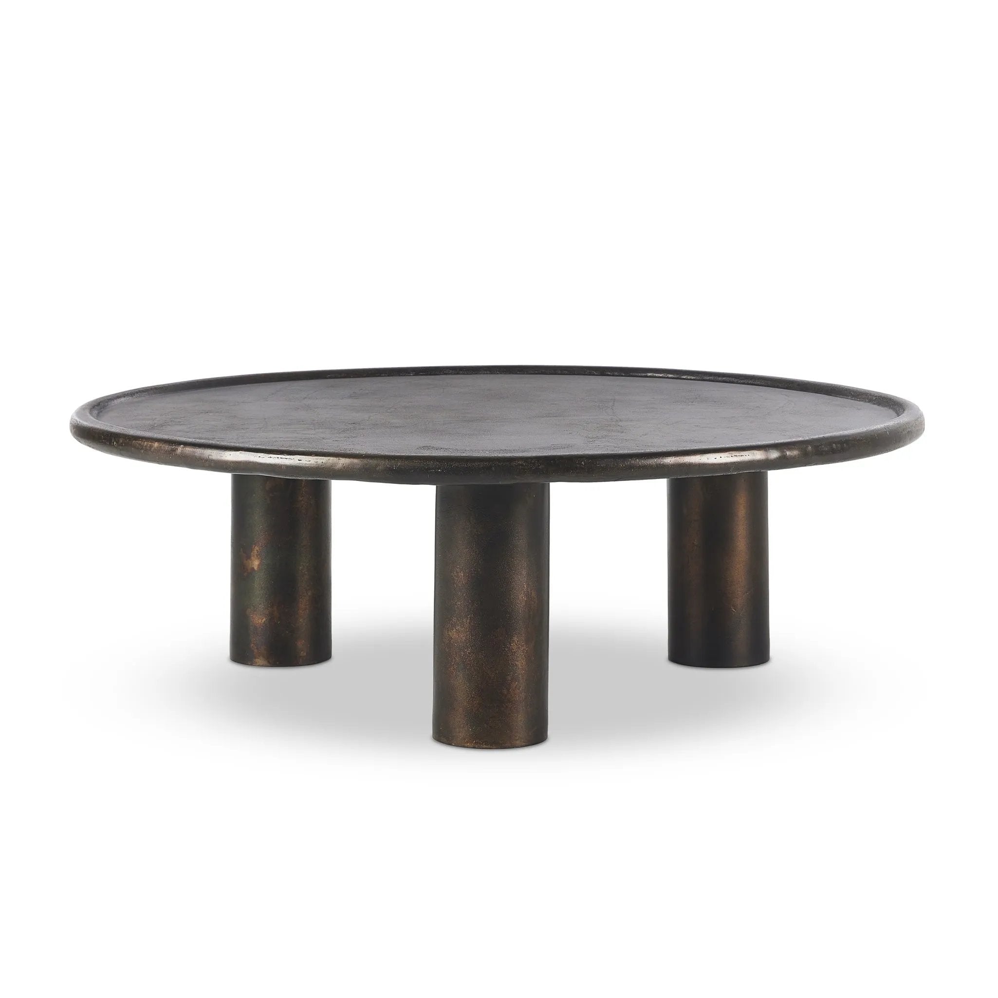 Featuring Cary Distressed Bronze Coffee Table by Four Hands at Amethyst Home. A round, three-legged coffee table of cast aluminum is finished in a beautiful distressed bronze. The result: a luxe take on industrial that moves between spaces and styles with ease.Overall Dimensions: 50.00"w x 50.00"d x 15.75"hWeight : 132.54 lbsMaterials: Aluminum. Amethyst Home provides interior design, new home construction design consulting, vintage area rugs, and lighting in the Park City metro area.