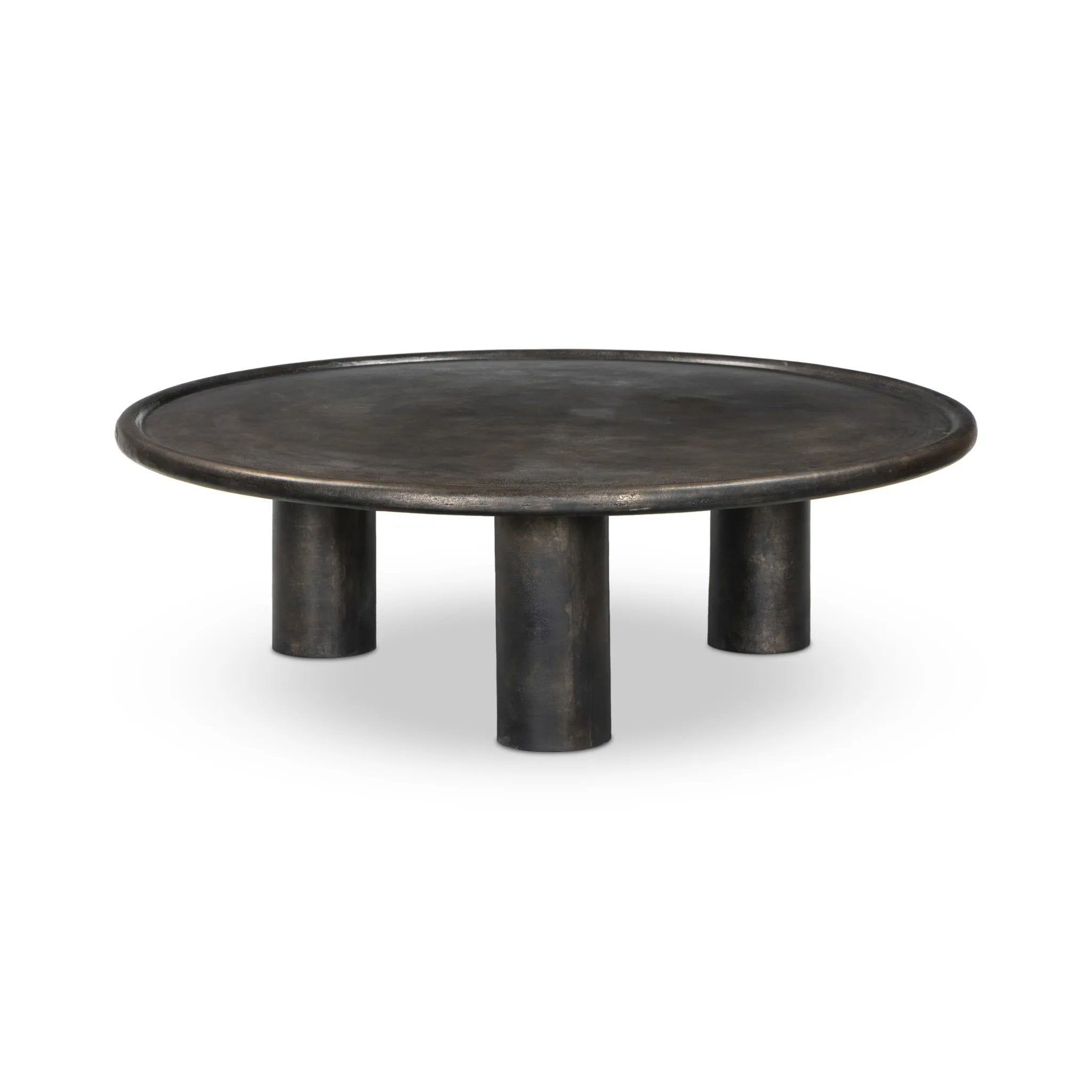 Featuring Cary Distressed Bronze Coffee Table by Four Hands at Amethyst Home. A round, three-legged coffee table of cast aluminum is finished in a beautiful distressed bronze. The result: a luxe take on industrial that moves between spaces and styles with ease.Overall Dimensions: 50.00"w x 50.00"d x 15.75"hWeight : 132.54 lbsMaterials: Aluminum. Amethyst Home provides interior design, new home construction design consulting, vintage area rugs, and lighting in the Seattle metro area.