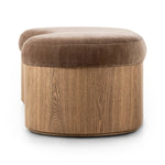 Elevate any room with a curvy statement bench. Made from a kidney-shaped base of toasted ash veneer and a soft, velvety seat Amethyst Home provides interior design, new home construction design consulting, vintage area rugs, and lighting in the Newport Beach metro area.