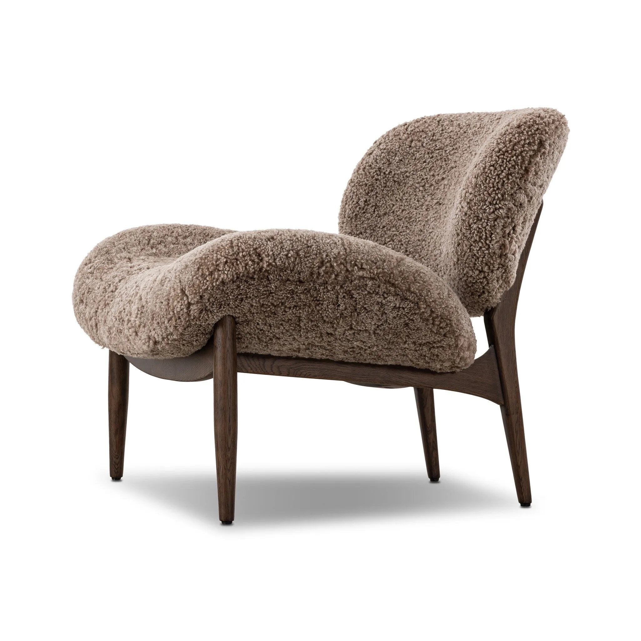 The perfect accent chair, designed for unwinding. Upholstered in a velvety olive chenille made from recycled materials, with wide proportions and cozy curves and cushioning. Slim, tapered wooden legs balance the look Amethyst Home provides interior design, new home construction design consulting, vintage area rugs, and lighting in the Charlotte metro area.