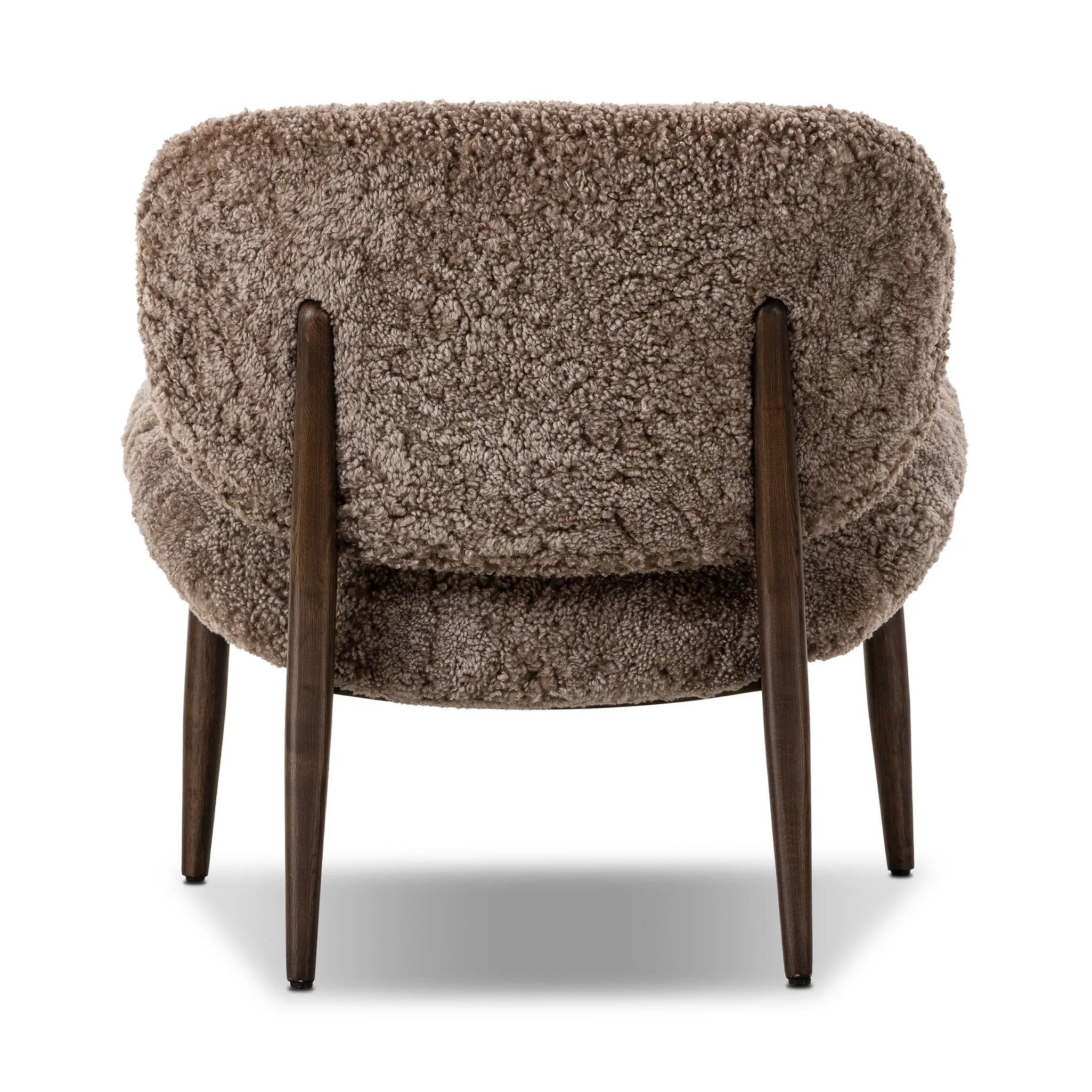 The perfect accent chair, designed for unwinding. Upholstered in a velvety olive chenille made from recycled materials, with wide proportions and cozy curves and cushioning. Slim, tapered wooden legs balance the look Amethyst Home provides interior design, new home construction design consulting, vintage area rugs, and lighting in the Miami metro area.