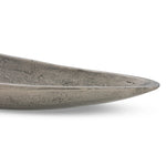 Statement-making centerpiece bowl featuring dramatic swooping lines, taking inspiration from Japanese fishing canoes. Cast in solid aluminum and supported by a single pedestal foot, giving the illusion that it's truly floating off the table.As lovers of clean design at Amethyst, we love the designer inspired Cerys Bowl - Raw Antique Nickel. Amethyst Home provides interior design, new home construction design consulting, vintage area rugs, and lighting in the Omaha metro area.