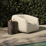 Meet modern comfort. Clean curves, impeccable tailoring and a soft, slightly heathered outdoor-friendly boucle bring an elevated, vintage European-inspired look to this outdoor swivel chair. Cover or store inside during inclement weather and when not in use. Amethyst Home provides interior design, new home construction design consulting, vintage area rugs, and lighting in the Des Moines metro area.