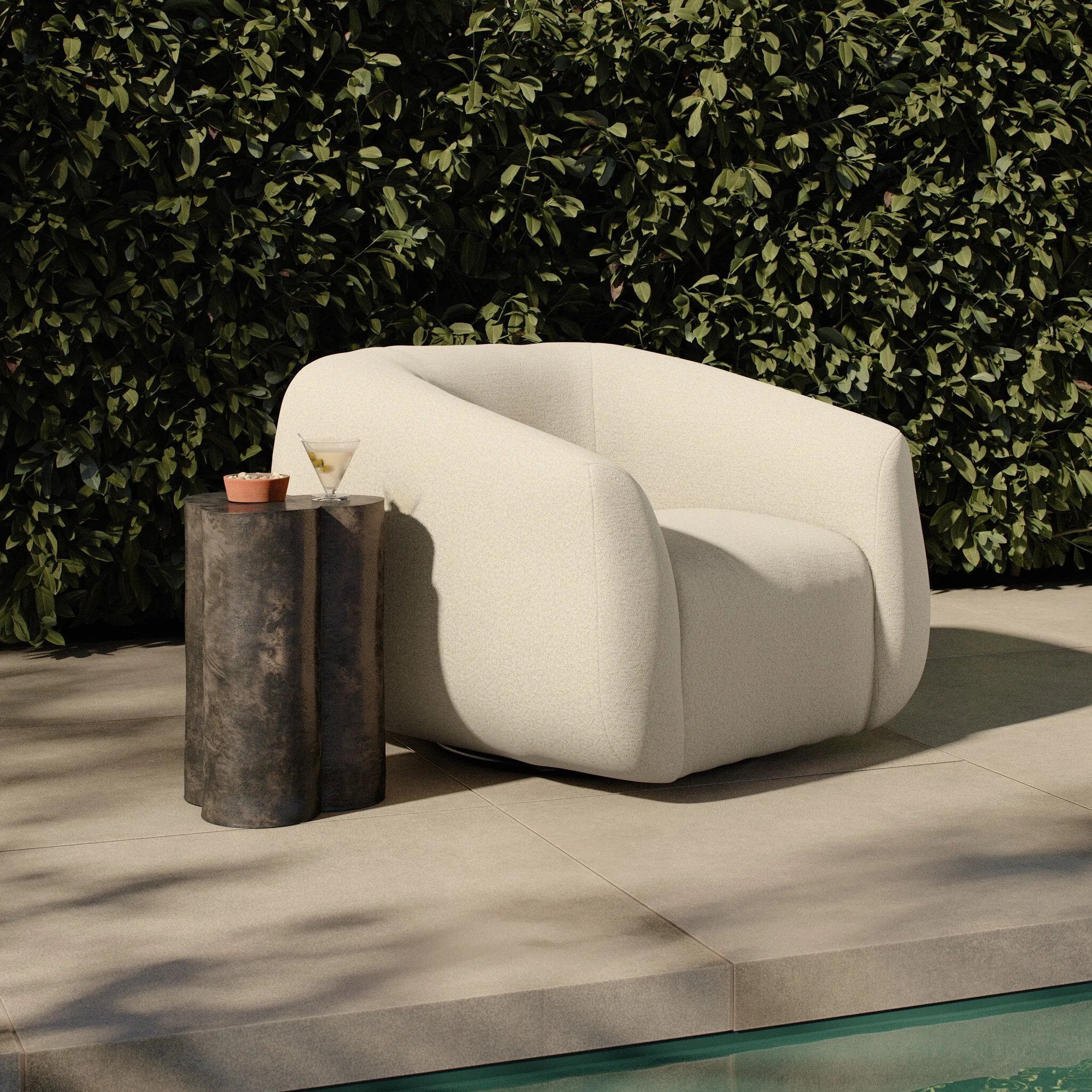 Meet modern comfort. Clean curves, impeccable tailoring and a soft, slightly heathered outdoor-friendly boucle bring an elevated, vintage European-inspired look to this outdoor swivel chair. Cover or store inside during inclement weather and when not in use. Amethyst Home provides interior design, new home construction design consulting, vintage area rugs, and lighting in the Des Moines metro area.