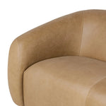 Meet modern comfort. Clean curves, impeccable tailoring and taupe top-grain leather with a pronounced grain bring an elevated, European-inspired look to this sofa Amethyst Home provides interior design, new home construction design consulting, vintage area rugs, and lighting in the Des Moines metro area.