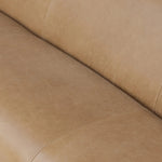 Meet modern comfort. Clean curves, impeccable tailoring and taupe top-grain leather with a pronounced grain bring an elevated, European-inspired look to this sofa Amethyst Home provides interior design, new home construction design consulting, vintage area rugs, and lighting in the Los Angeles metro area.