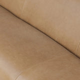 Meet modern comfort. Clean curves, impeccable tailoring and taupe top-grain leather with a pronounced grain bring an elevated, European-inspired look to this sofa Amethyst Home provides interior design, new home construction design consulting, vintage area rugs, and lighting in the Los Angeles metro area.