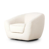 Inspired by French modernism with a nod to Jean Royere's design classic, the Polaire. Our take is defined by exaggerated curves, tapered arms and oversized welt detailing along the reversible seat cushion for a tailored look, finished with a 360-degree swivel. Amethyst Home provides interior design, new home construction design consulting, vintage area rugs, and lighting in the San Diego metro area.