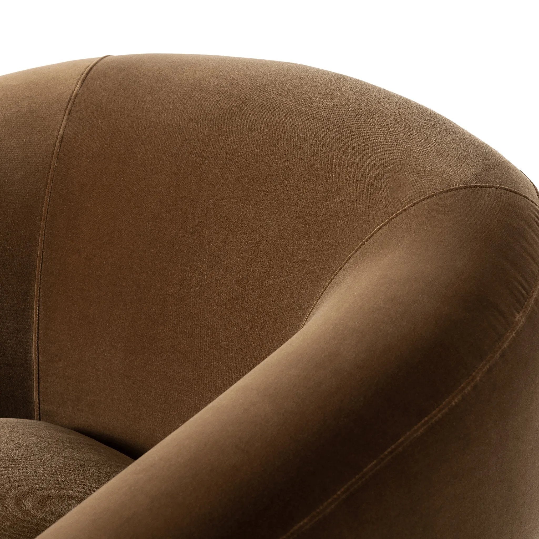 Inspired by French modernism with a nod to Jean Royere's design classic, the Polaire. Our take is defined by exaggerated curves, tapered arms and oversized welt detailing along the reversible seat cushion for a tailored look, finished with a 360-degree swivel. Amethyst Home provides interior design, new home construction design consulting, vintage area rugs, and lighting in the Boston metro area.