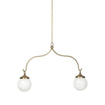 A chandelier inspired by Art Deco, featuring a pair of glass globes suspended from graciously curved iron arms finished in aged brass Amethyst Home provides interior design, new home construction design consulting, vintage area rugs, and lighting in the Boston metro area.