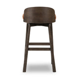 Featuring Cloris Altair Sienna Swivel Bar + Counter Stool by Four Hands at Amethyst Home. Channel vintage vibes with a swivel stool perfectly sized for the bar. Crafted of dark-finished oak, a low, molded back adds a playful touch, while an upholstered seat offers comfort and color. Finished off with a memory swivel to ensure the stool's curved wood bac. Amethyst Home provides interior design, new home construction design consulting, vintage area rugs, and lighting in the Newport Beach metro area.