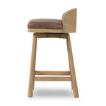 Featuring Cloris Palermo Cigar Swivel Bar + Counter Stool by Four Hands at Amethyst Home. Channel vintage vibes with a swivel stool perfectly sized for the bar. Crafted of blonde-finished oak, a low, molded back adds a playful touch, while a top-grain leather seat offers luxe comfort. Finished off with a memory swivel to ensure the stool's curved wood back. Amethyst Home provides interior design, new home construction design consulting, vintage area rugs, and lighting in the Alpharetta metro area.