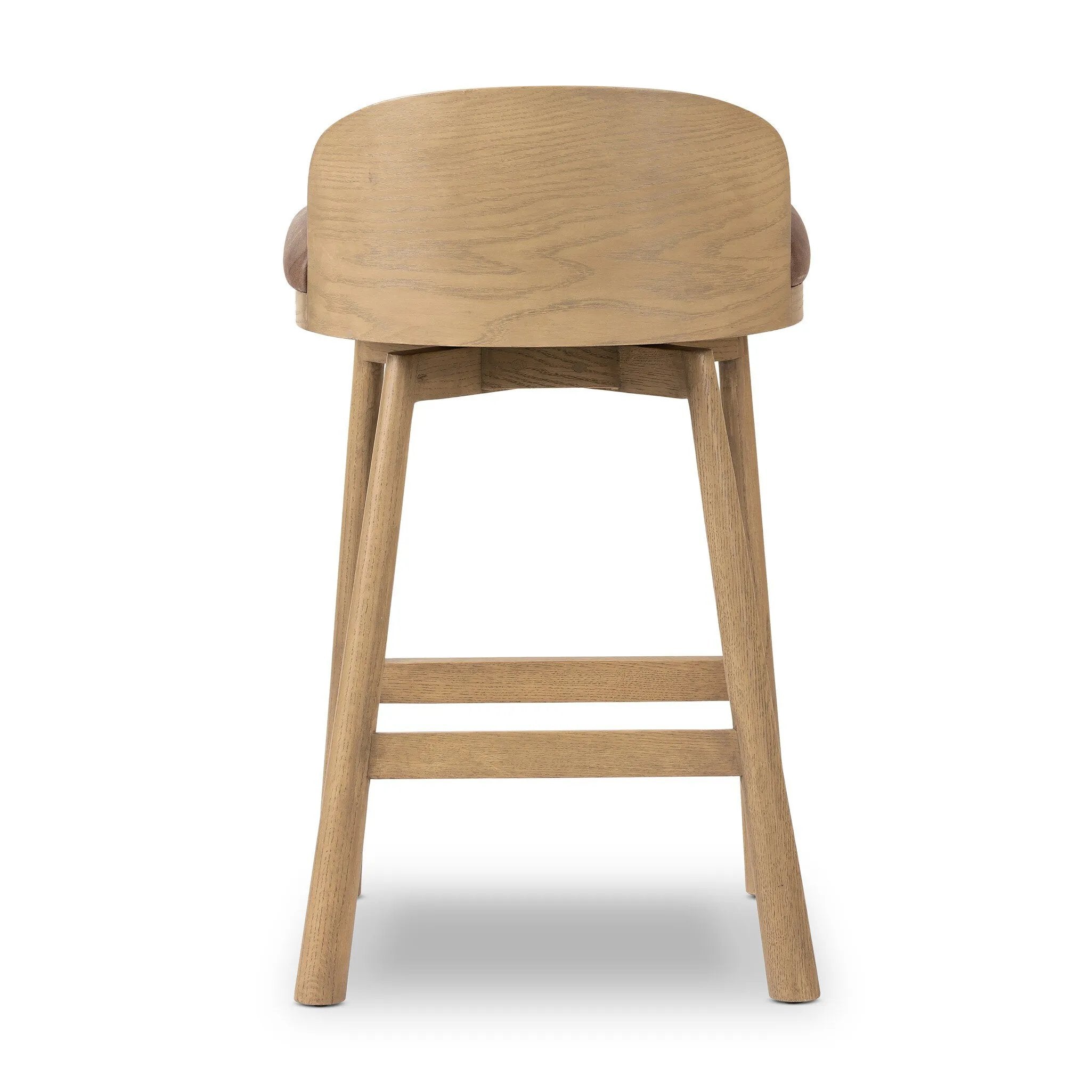 Featuring Cloris Palermo Cigar Swivel Bar + Counter Stool by Four Hands at Amethyst Home. Channel vintage vibes with a swivel stool perfectly sized for the bar. Crafted of blonde-finished oak, a low, molded back adds a playful touch, while a top-grain leather seat offers luxe comfort. Finished off with a memory swivel to ensure the stool's curved wood back sta. Amethyst Home provides interior design, new home construction design consulting, vintage area rugs, and lighting in the Austin metro area.