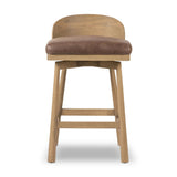 Featuring Cloris Palermo Cigar Swivel Bar + Counter Stool by Four Hands at Amethyst Home. Channel vintage vibes with a swivel stool perfectly sized for the bar. Crafted of blonde-finished oak, a low, molded back adds a playful touch, while a top-grain leather seat offers luxe comfort. Finished off with a memory swivel to ensure the stool's curved wood back sta. Amethyst Home provides interior design, new home construction design consulting, vintage area rugs, and lighting in the Boston metro area.