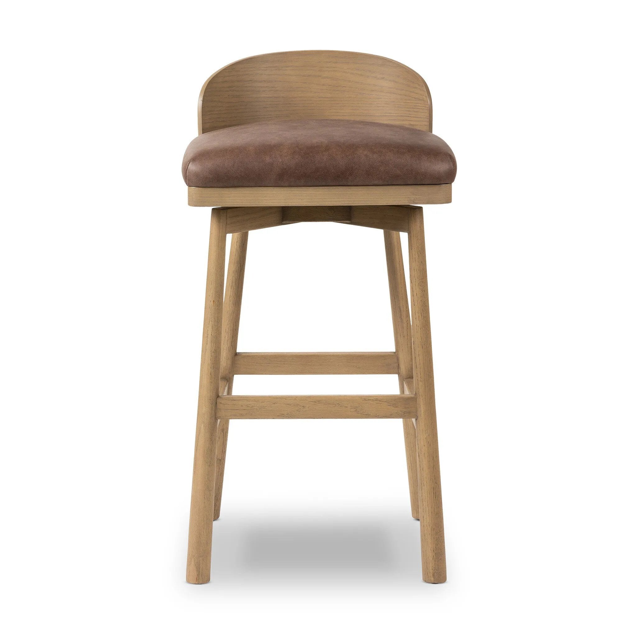 Featuring Cloris Palermo Cigar Swivel Bar + Counter Stool by Four Hands at Amethyst Home. Channel vintage vibes with a swivel stool perfectly sized for the bar. Crafted of blonde-finished oak, a low, molded back adds a playful touch, while a top-grain leather seat offers luxe comfort. Finished off with a memory swivel to ensure the stool's curved wood back sta. Amethyst Home provides interior design, new home construction design consulting, vintage area rugs, and lighting in the Dallas metro area.