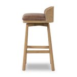 Featuring Cloris Palermo Cigar Swivel Bar + Counter Stool by Four Hands at Amethyst Home. Channel vintage vibes with a swivel stool perfectly sized for the bar. Crafted of blonde-finished oak, a low, molded back adds a playful touch, while a top-grain leather seat offers luxe comfort. Finished off with a memory swivel to ensure the stool's curved wood back . Amethyst Home provides interior design, new home construction design consulting, vintage area rugs, and lighting in the Park City metro area.
