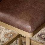 Featuring Cloris Palermo Cigar Swivel Bar + Counter Stool by Four Hands at Amethyst Home. Channel vintage vibes with a swivel stool perfectly sized for the bar. Crafted of blonde-finished oak, a low, molded back adds a playful touch, while a top-grain leather seat offers luxe comfort. Finished off with a memory swivel to ensure the stool's curved wood . Amethyst Home provides interior design, new home construction design consulting, vintage area rugs, and lighting in the Salt Lake City metro area.