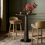 Featuring Cloris Palermo Cigar Swivel Bar + Counter Stool by Four Hands at Amethyst Home. Channel vintage vibes with a swivel stool perfectly sized for the bar. Crafted of blonde-finished oak, a low, molded back adds a playful touch, while a top-grain leather seat offers luxe comfort. Finished off with a memory swivel to ensure the stool's curved wood b. Amethyst Home provides interior design, new home construction design consulting, vintage area rugs, and lighting in the Winter Garden metro area.