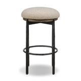 Contrasting materials come together to create an elevated counter stool. Designed with tapered cast iron legs and a solid oak seat base topped with an upholstered padded seat. Swivels 360 degrees. Seat is covered in 100% olefin, known for its UV-resistant, water-repellent and quick-drying abilities Amethyst Home provides interior design, new home construction design consulting, vintage area rugs, and lighting in the Dallas metro area.