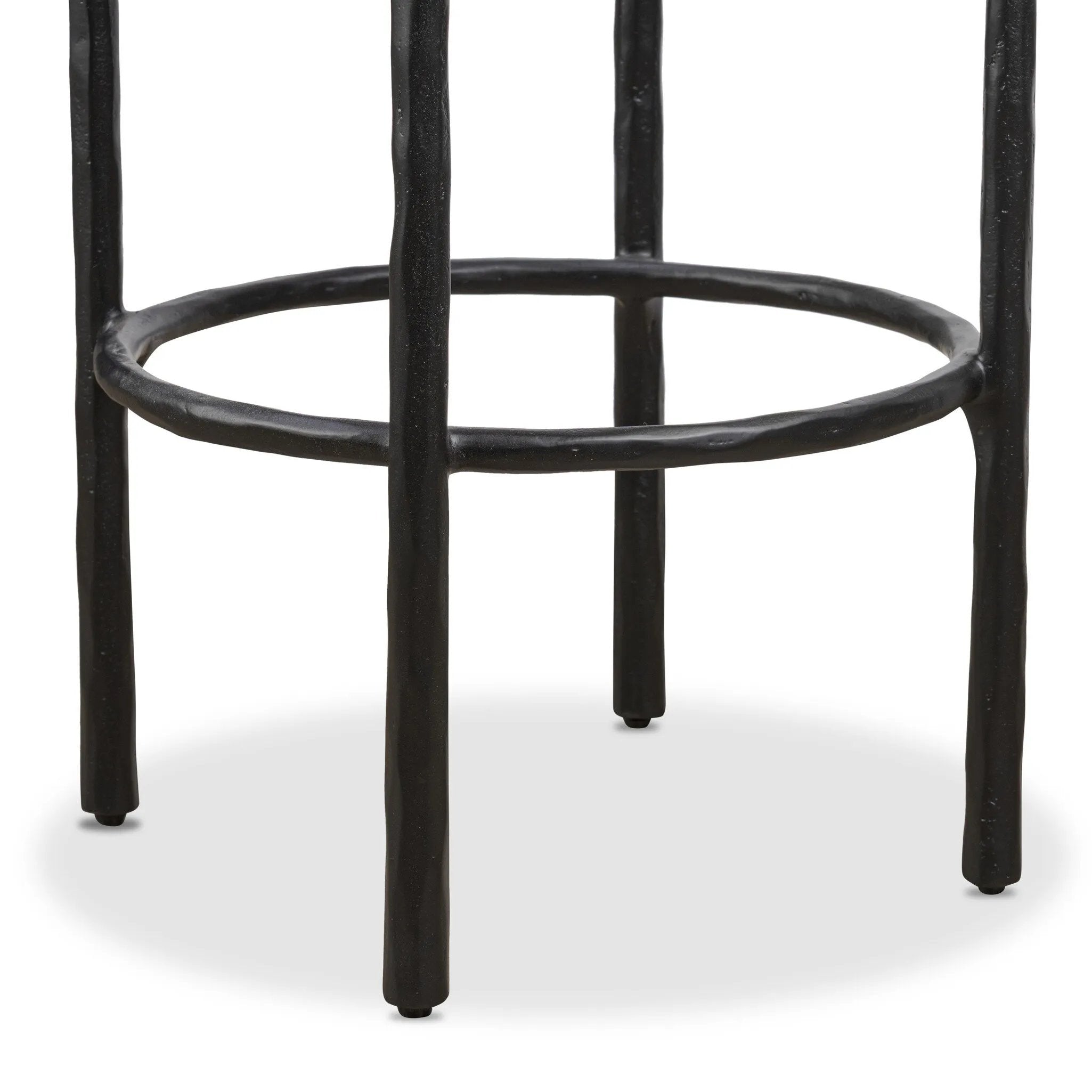 Contrasting materials come together to create an elevated counter stool. Designed with tapered cast iron legs and a solid oak