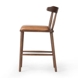 Featuring Colter Chaps Saddle Counter Stool by Four Hands at Amethyst Home. Made from solid ash with a vintage finish, this versatile counter stool pairs an airy back with tapered spindles, for a simple, inviting look. A fixed upholstered seat of top-grain leather adds a smart, comfortable touch.Overall Dimensions: 20.50"w x 22.75"d x 38.25"hWeight : 13. Amethyst Home provides interior design, new home construction design consulting, vintage area rugs, and lighting in the Winter Garden metro area.