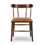 Featuring Colter Chaps Saddle Dining Chair by Four Hands at Amethyst Home. Made from solid ash with a vintage finish, this versatile dining chair pairs an airy back with tapered spindles, for a simple, inviting look. Fixed upholstered seat of top-grain leather adds a fresh, comfortable touch.Overall Dimensions: 20.50"w x 23.25"d x 31.25"hWeight : 13.01 lbs. Amethyst Home provides interior design, new home construction design consulting, vintage area rugs, and lighting in the Alpharetta metro area.