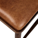 Featuring Colter Chaps Saddle Dining Chair by Four Hands at Amethyst Home. Made from solid ash with a vintage finish, this versatile dining chair pairs an airy back with tapered spindles, for a simple, inviting look. Fixed upholstered seat of top-grain leather adds a fresh, comfortable touch.Overall Dimensions: 20.50"w x 23.25"d x 31.25"hWeight : 13.01 lb. Amethyst Home provides interior design, new home construction design consulting, vintage area rugs, and lighting in the Los Angeles metro area.