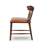 Featuring Colter Chaps Saddle Dining Chair by Four Hands at Amethyst Home. Made from solid ash with a vintage finish, this versatile dining chair pairs an airy back with tapered spindles, for a simple, inviting look. Fixed upholstered seat of top-grain leather adds a fresh, comfortable touch.Overall Dimensions: 20.50"w x 23.25"d x 31.25"hWeight : 13.01 lbsMater. Amethyst Home provides interior design, new home construction design consulting, vintage area rugs, and lighting in the Omaha metro area.