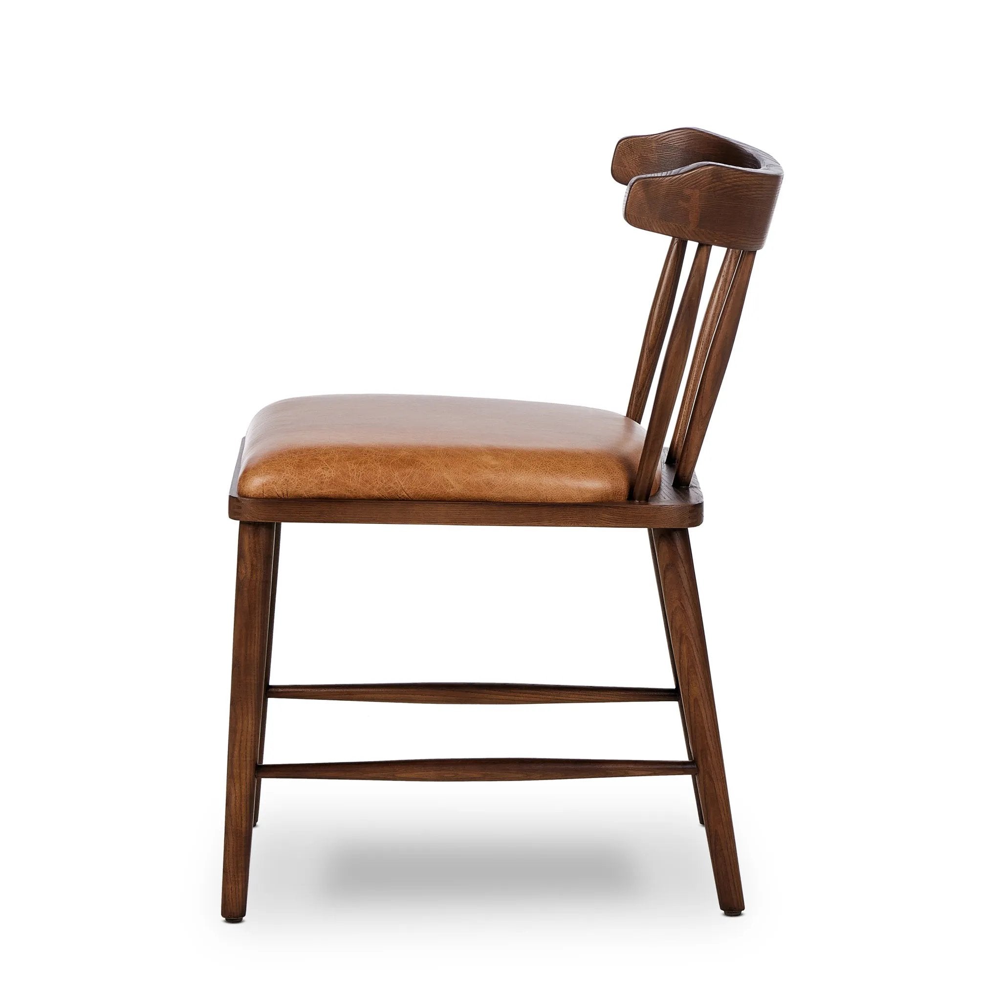 Featuring Colter Chaps Saddle Dining Chair by Four Hands at Amethyst Home. Made from solid ash with a vintage finish, this versatile dining chair pairs an airy back with tapered spindles, for a simple, inviting look. Fixed upholstered seat of top-grain leather adds a fresh, comfortable touch.Overall Dimensions: 20.50"w x 23.25"d x 31.25"hWeight : 13.01 lbsMater. Amethyst Home provides interior design, new home construction design consulting, vintage area rugs, and lighting in the Omaha metro area.