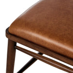 Featuring Colter Chaps Saddle Dining Chair by Four Hands at Amethyst Home. Made from solid ash with a vintage finish, this versatile dining chair pairs an airy back with tapered spindles, for a simple, inviting look. Fixed upholstered seat of top-grain leather adds a fresh, comfortable touch.Overall Dimensions: 20.50"w x 23.25"d x 31.25"hWeight : 13.01 lbs. Amethyst Home provides interior design, new home construction design consulting, vintage area rugs, and lighting in the Washington metro area.