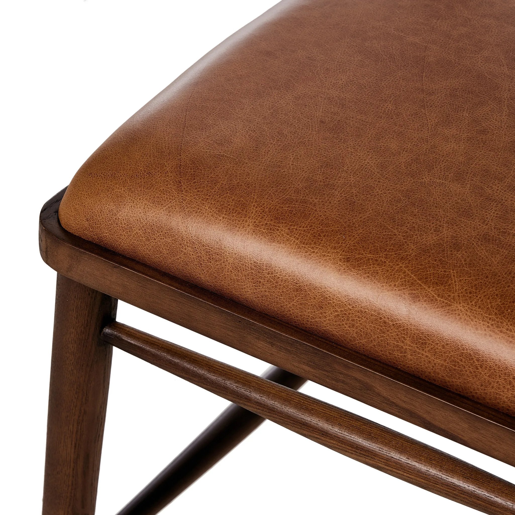 Featuring Colter Chaps Saddle Dining Chair by Four Hands at Amethyst Home. Made from solid ash with a vintage finish, this versatile dining chair pairs an airy back with tapered spindles, for a simple, inviting look. Fixed upholstered seat of top-grain leather adds a fresh, comfortable touch.Overall Dimensions: 20.50"w x 23.25"d x 31.25"hWeight : 13.01 lbs. Amethyst Home provides interior design, new home construction design consulting, vintage area rugs, and lighting in the Washington metro area.
