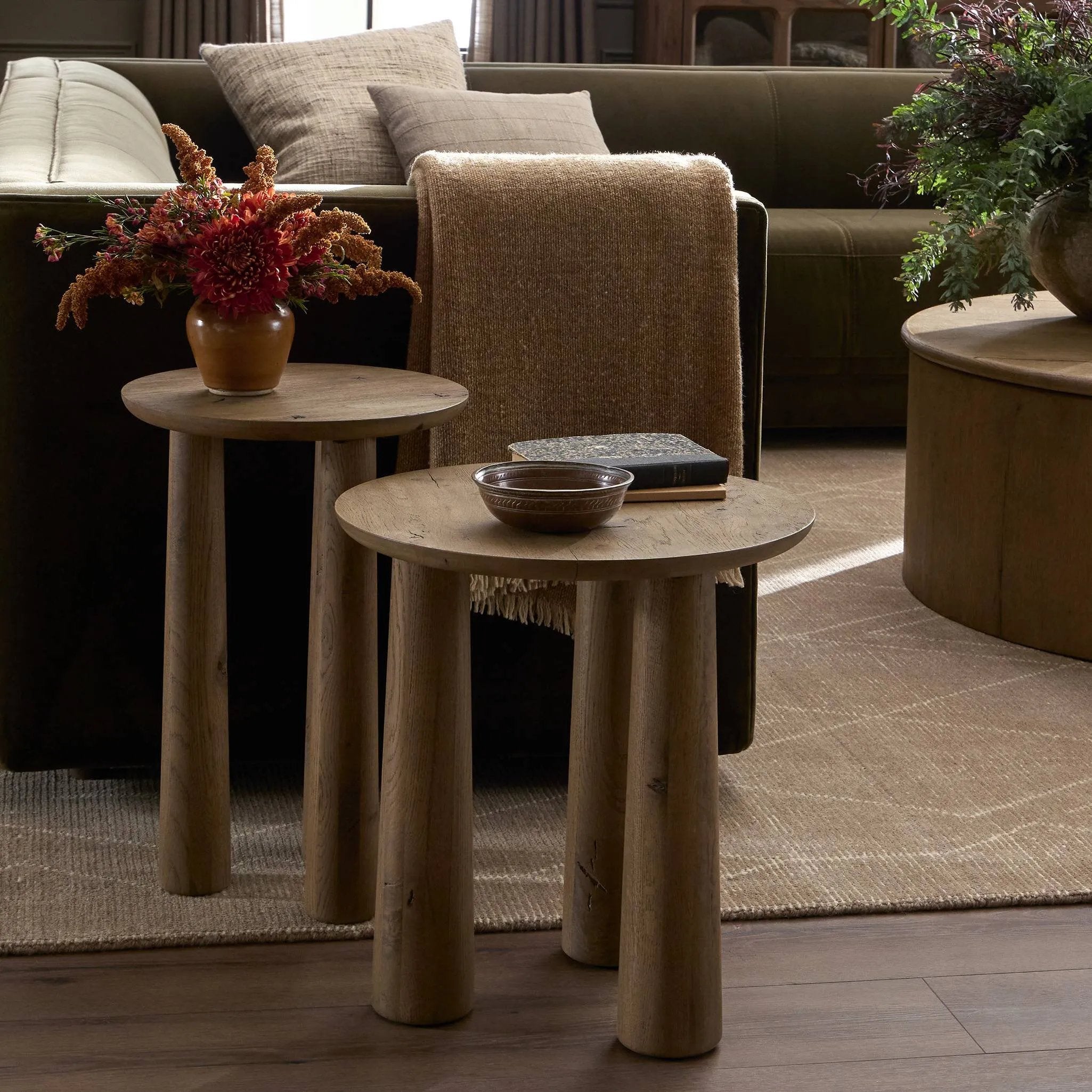 Chamfered tops and tapered legs define the artisanship of these three-leg nesting tables. Crafted from drifted oak veneer, their natural texture and clean design make them a clever addition to any room, whether styled together or apart Amethyst Home provides interior design, new home construction design consulting, vintage area rugs, and lighting in the Newport Beach metro area.