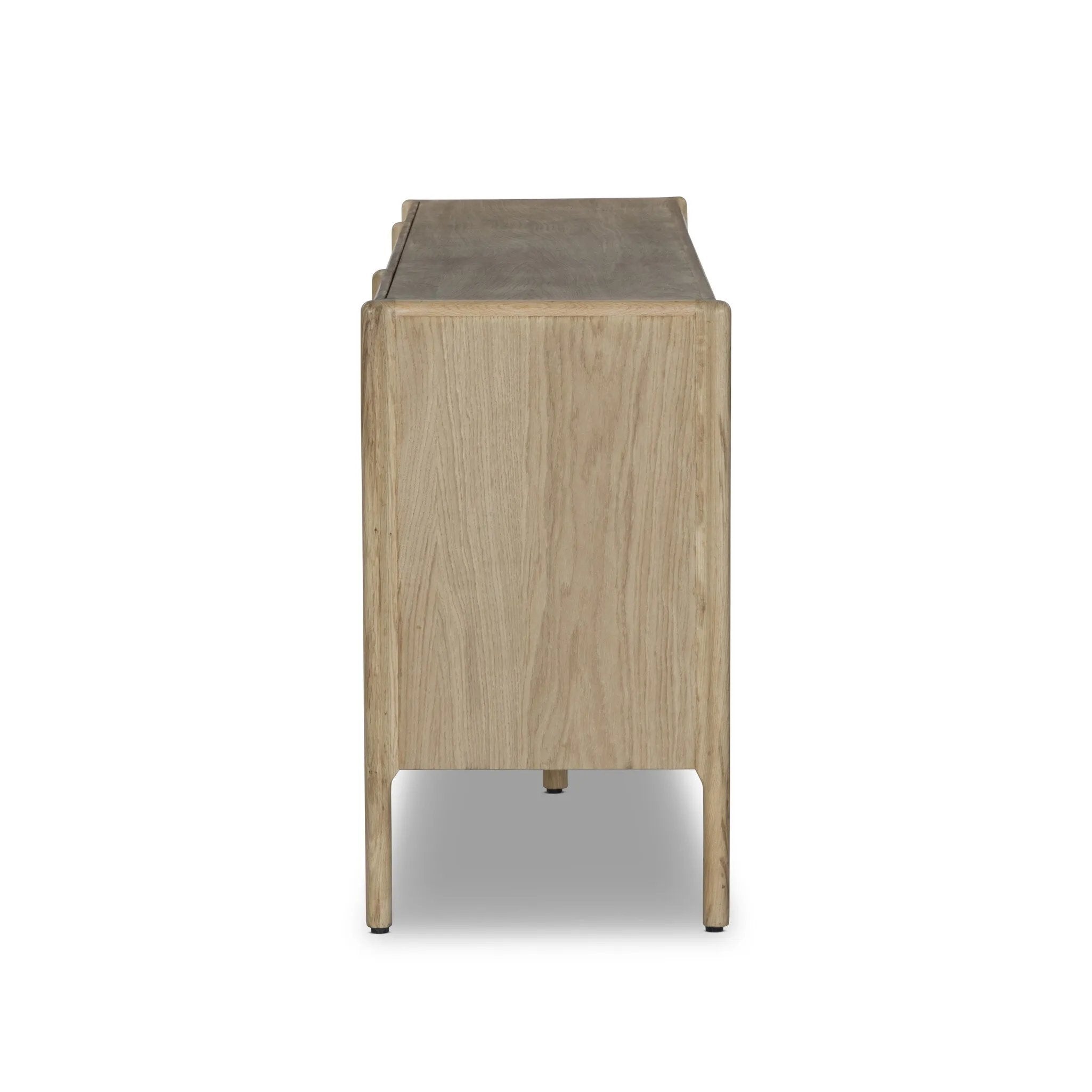 Add storage to your dining space, plus a look of beautiful simplicity. Crafted of light natural oak, with cylindrical legs and rounded detailing throughout the case. Spacious inside awaits storage of favorite table linens, serveware and more. Amethyst Home provides interior design, new home construction design consulting, vintage area rugs, and lighting in the Kansas City metro area.