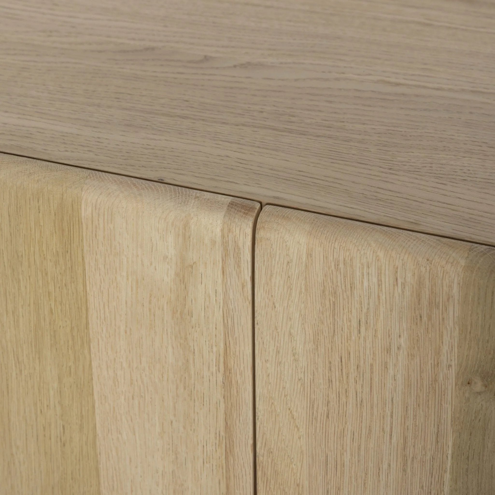 Add storage to your dining space, plus a look of beautiful simplicity. Crafted of light natural oak, with cylindrical legs and rounded detailing throughout the case. Spacious inside awaits storage of favorite table linens, serveware and more. Amethyst Home provides interior design, new home construction design consulting, vintage area rugs, and lighting in the Monterey metro area.