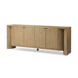 Featuring Cristopher Rubbed Light Oak Veneer Sideboard by Four Hands at Amethyst Home. A playful placement of rounded shapes and clean lines, this sideboard captivates with half-cylinder legs seamlessly blending into the storage case and top, complete with curved metal hardware. Finished in light oak for warm, light look that can move between styles with ease.. Amethyst Home provides interior design, new home construction design consulting, vintage area rugs, and lighting in the Austin metro area.