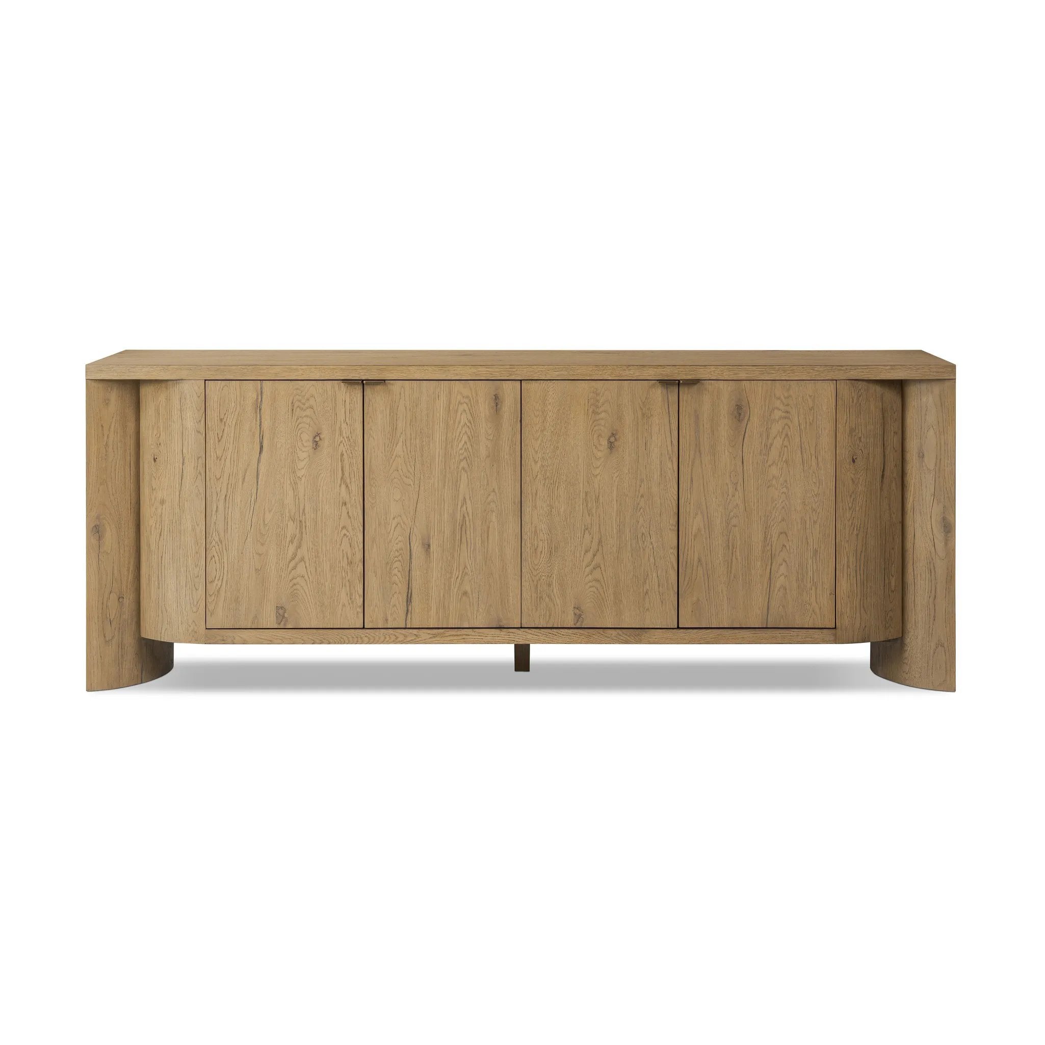 Featuring Cristopher Rubbed Light Oak Veneer Sideboard by Four Hands at Amethyst Home. A playful placement of rounded shapes and clean lines, this sideboard captivates with half-cylinder legs seamlessly blending into the storage case and top, complete with curved metal hardware. Finished in light oak for warm, light look that can move between styles with ea. Amethyst Home provides interior design, new home construction design consulting, vintage area rugs, and lighting in the Charlotte metro area.