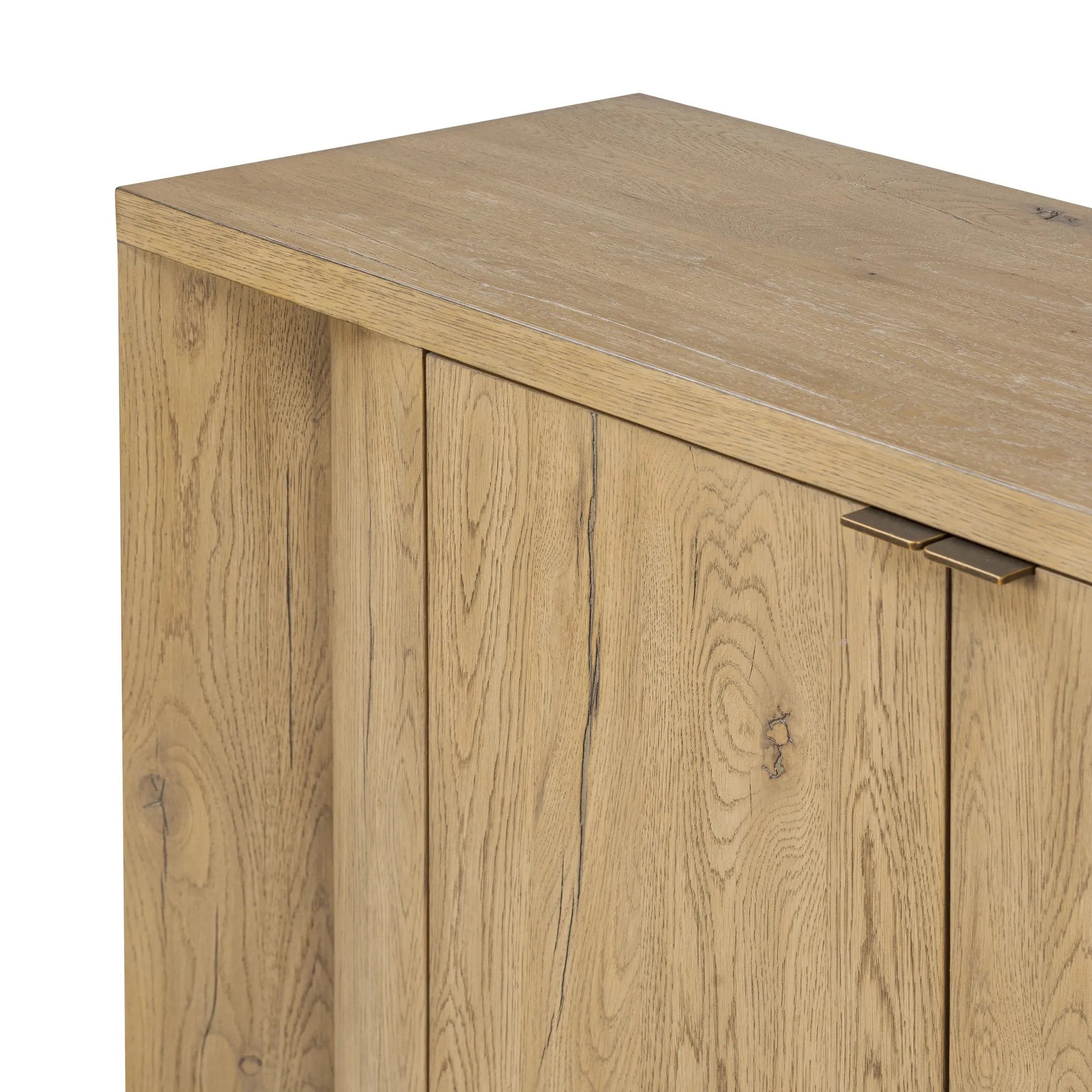 Featuring Cristopher Rubbed Light Oak Veneer Sideboard by Four Hands at Amethyst Home. A playful placement of rounded shapes and clean lines, this sideboard captivates with half-cylinder legs seamlessly blending into the storage case and top, complete with curved metal hardware. Finished in light oak for warm, light look that can move between styles with ea. Amethyst Home provides interior design, new home construction design consulting, vintage area rugs, and lighting in the Nashville metro area.