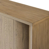 Featuring Cristopher Rubbed Light Oak Veneer Sideboard by Four Hands at Amethyst Home. A playful placement of rounded shapes and clean lines, this sideboard captivates with half-cylinder legs seamlessly blending into the storage case and top, complete with curved metal hardware. Finished in light oak for warm, light look that can move between styles wi. Amethyst Home provides interior design, new home construction design consulting, vintage area rugs, and lighting in the Salt Lake City metro area.