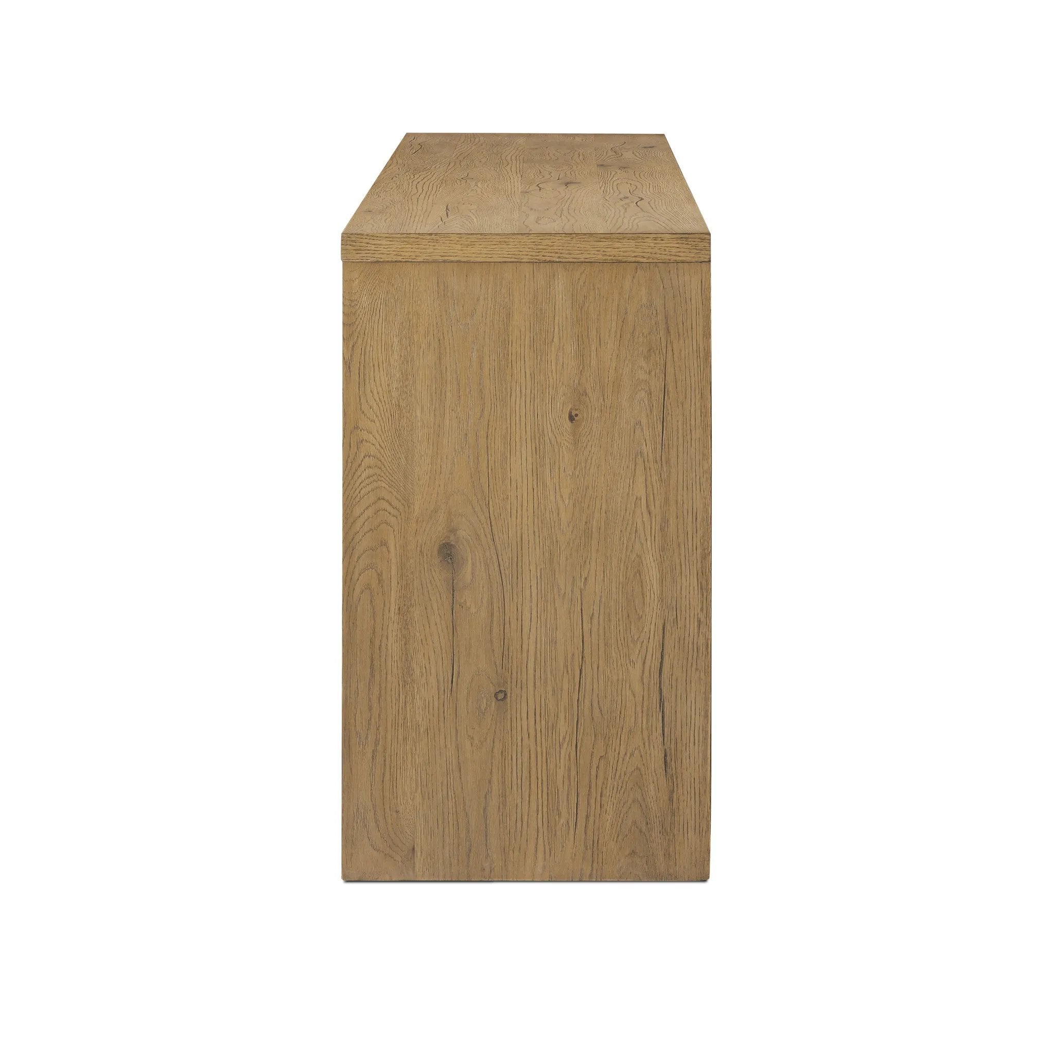 Featuring Cristopher Rubbed Light Oak Veneer Sideboard by Four Hands at Amethyst Home. A playful placement of rounded shapes and clean lines, this sideboard captivates with half-cylinder legs seamlessly blending into the storage case and top, complete with curved metal hardware. Finished in light oak for warm, light look that can move between styles with e. Amethyst Home provides interior design, new home construction design consulting, vintage area rugs, and lighting in the Scottsdale metro area.